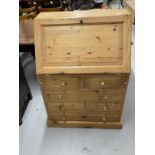 Modern pine bureau, the fall front over two short and three long drawers, the interior having two