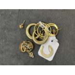 Hallmarked Gold: 9ct seven pairs of assorted earrings to include hoops and knots style. Total weight