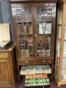 Edwardian mahogany display cabinet with glazed doors above two drawers. 36ins. x 72ins. x 9½ins.