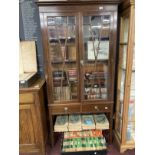 Edwardian mahogany display cabinet with glazed doors above two drawers. 36ins. x 72ins. x 9½ins.