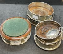 Wine Collectables: Hallmarked silver wine coaster with treen base, London 1980, a pair. Plus three