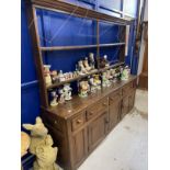 18th cent. Oak dresser with open rack, the base with five drawers over two doors and three panels,