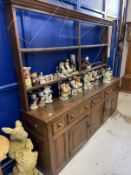 18th cent. Oak dresser with open rack, the base with five drawers over two doors and three panels,