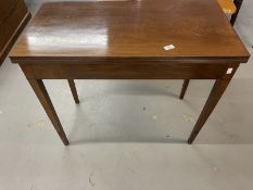 19th cent. Mahogany tea table, the rectangular top with reeded edge on squared tapered legs.