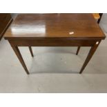 19th cent. Mahogany tea table, the rectangular top with reeded edge on squared tapered legs.