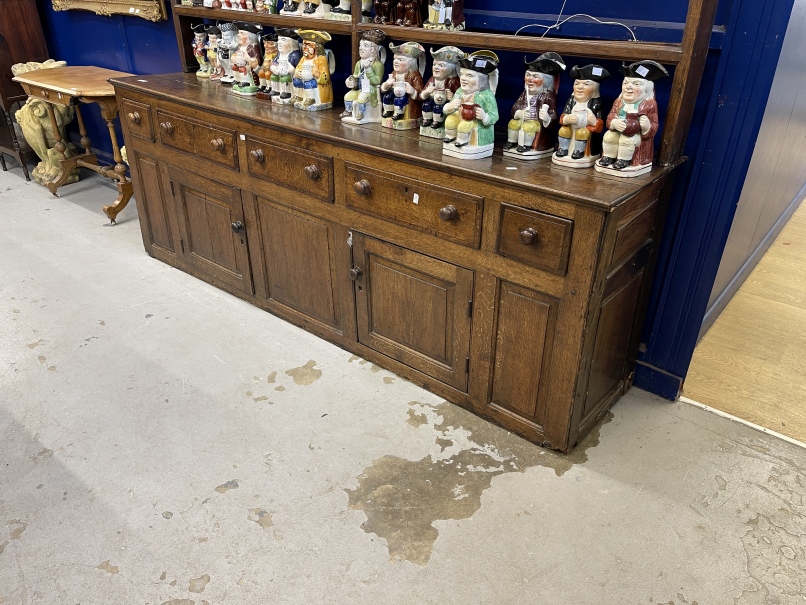 18th cent. Oak dresser with open rack, the base with five drawers over two doors and three panels, - Image 2 of 3