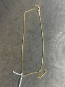 Jewellery: Yellow metal curb link chain, tests as 18ct gold. Length 16ins. Plus a coin mount A/F.