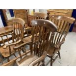 19th cent. Harlequin set of four beech, elm and oak slat back kitchen armchairs.