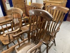 19th cent. Harlequin set of four beech, elm and oak slat back kitchen armchairs.