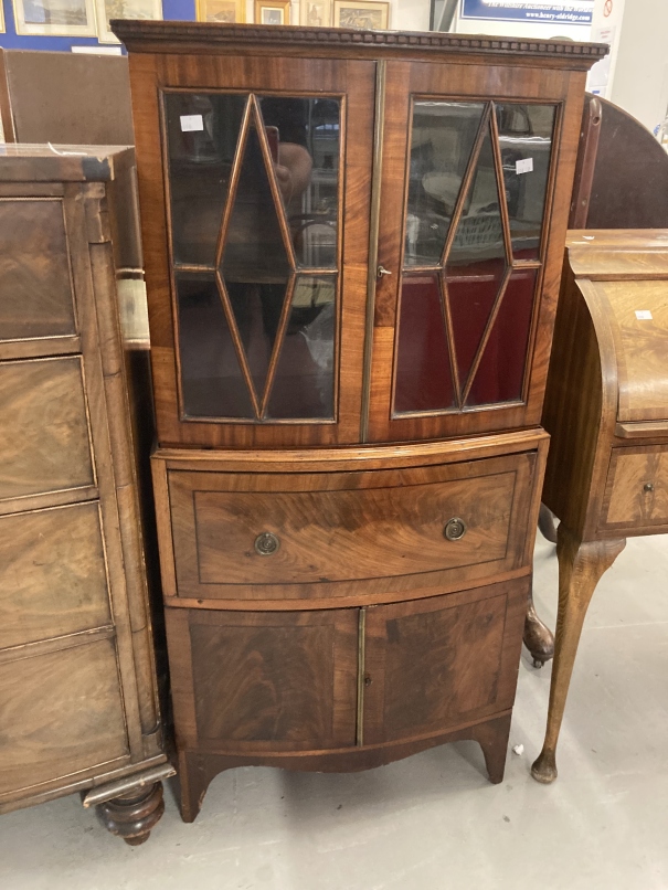 19th cent. Display cabinet of modest proportions, the upper section with two glazed doors, the lower