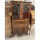 19th cent. Display cabinet of modest proportions, the upper section with two glazed doors, the lower