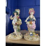 Early 19th cent. Minton candlestick figures of a boy and girl flower sellers, with further blooms