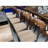 19th cent. Mahogany bar back dining chairs upholstered with striped material, sabre rear legs and