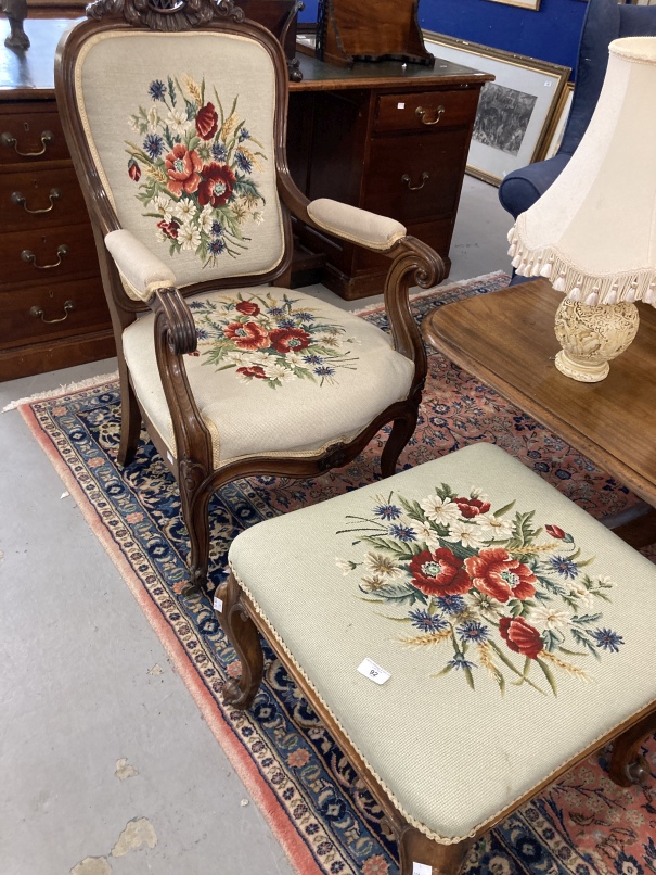19th cent. Heavily carved tapestry covered open arm chair together with a similarly covered