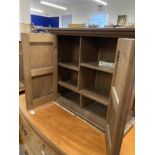 20th cent. Oak wall hanging cupboard of modest proportions, four panels to the two front doors and