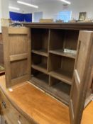 20th cent. Oak wall hanging cupboard of modest proportions, four panels to the two front doors and