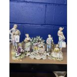 19th/20th cent. Continental Figurines: Seated boy and girl him with dog her with flowers possibly