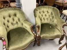 19th cent. Green upholstered button back saloon chair with carved scrolled arms, on brass castors. A