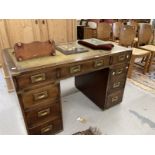 20th cent. Mahogany twin pedestal desk, campaign style handles and fittings, each pedestal with