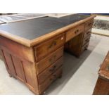 Edwardian mahogany stained nine drawer twin pedestal desk with brass drop handles. Approx. 66ins.