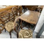 Early 19th cent. Mahogany oval dining table with two flaps on a baluster shaped column and four