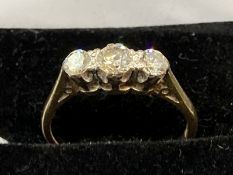 Jewellery: Yellow metal ring set with three brilliant cut diamonds, estimated weight of (3) 0.