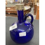 19th cent. Bristol Blue handled flagon decanter, white metal plated rim, no stopper. Height 7½ins.