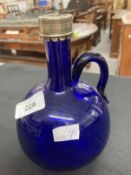 19th cent. Bristol Blue handled flagon decanter, white metal plated rim, no stopper. Height 7½ins.