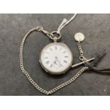 Hallmarked Silver: open faced pocket watch key wind white dial with black Roman numerals and a watch