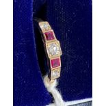 Jewellery: Yellow metal half hoop ring set with three brilliant cut diamonds, estimated weight of (