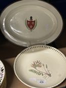 Ceramics: 19th cent. Oval cream ware dish with a armorial to the centre. Small chip to back of rim