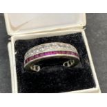 Jewellery: Art Deco night and day ring with rubies on a white metal setting, tests as 9ct white