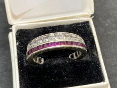 Jewellery: Art Deco night and day ring with rubies on a white metal setting, tests as 9ct white