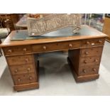 19th cent. Mahogany knee hole desk, two four drawer pedestals with one central drawer, green