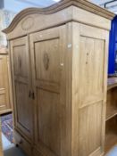 20th cent. Stripped pine Continental wardrobe with two doors over two drawers. Approx. 84ins. x