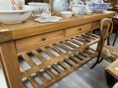 20th cent. Oak kitchen island/buffet with three drawers and two slatted shelves. Approx. 72ins. x