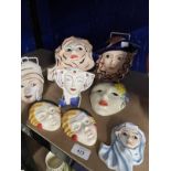 20th cent. Ceramics: Three Art Deco style Crown Devon pottery wall masks, hand painted and signed by