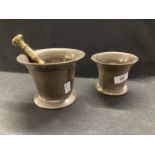 18th/19th cent. Bronze mortar with brass pestle plus one other.