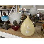 Lighting: 19th and 20th cent. Oil lamps and glass shades, plus two metal North African lamps.