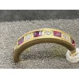 Hallmarked Jewellery: 18ct gold nine stone half hoop ring set with four brilliant cut diamonds,