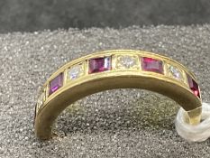 Hallmarked Jewellery: 18ct gold nine stone half hoop ring set with four brilliant cut diamonds,