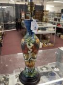 20th cent. Ceramics: Moorcroft lamp in the 'Anna Lily' pattern designed by Nicola Slaney, waisted