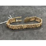 Hallmarked Jewellery: 9ct gold open link bark finished links with fold over clasp. Length 7ins.