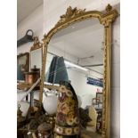 19th cent. Giltwood over mantel mirror arch top with wreath, finials swag and decoration. 5ft. x
