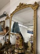 19th cent. Giltwood over mantel mirror arch top with wreath, finials swag and decoration. 5ft. x