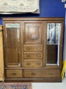 20th cent. Arts and Crafts mahogany, mirror fronted wardrobe by John Taylor & Son of Edinburgh,