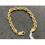 Jewellery: Yellow metal curb link bracelet, tests as 18ct gold. Length 7ins. Weight 15.3g.