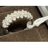 Jewellery: White metal three row half hoop ring set with twenty-eight brilliant cut diamonds,