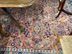 Carpets & Rugs: 20th cent. Persian carpet, pink ground the central panel with leaf and floral