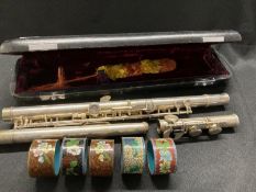 20th cent. Cloisonne napkin rings of various colours, plus a Lewington 'Parrot' flute.